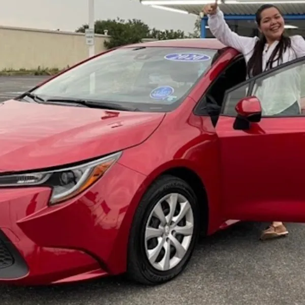Happy customer with her new Toyota Corolla