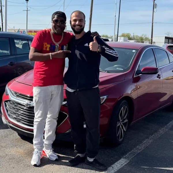 Customer picking up his new vehicle with Hamza